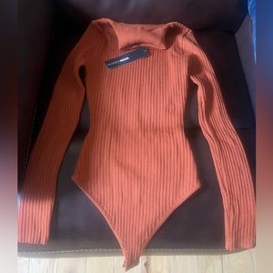 Rust color ribbed turtleneck bodysuit